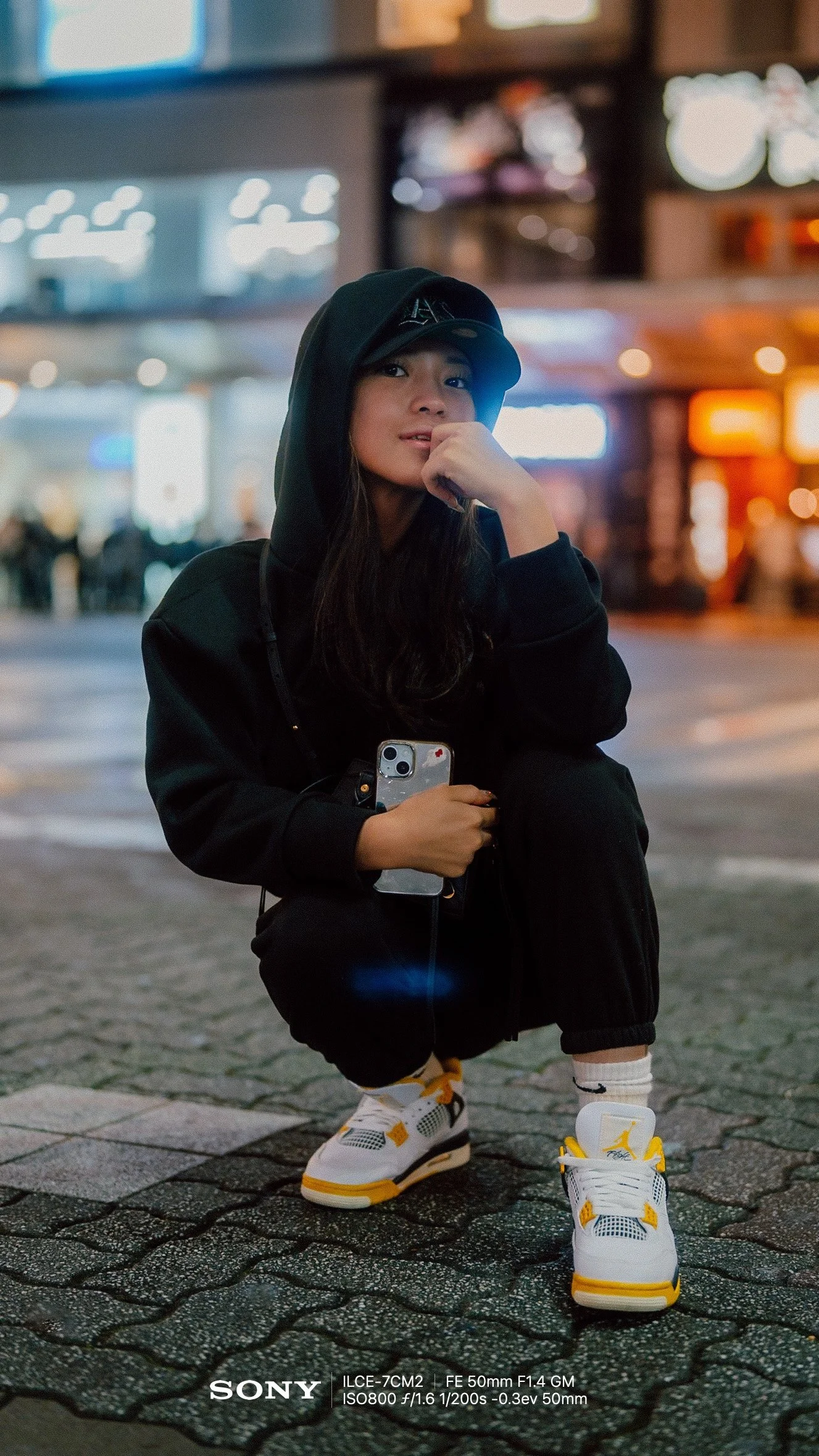  Relaxed Arms (V2)    “Stand tall and let your arms hang naturally by your sides. Laugh away from the camera as if a friend just told you a good joke.”  Women, 🌆 City, ✨ Advanced, 50mm 