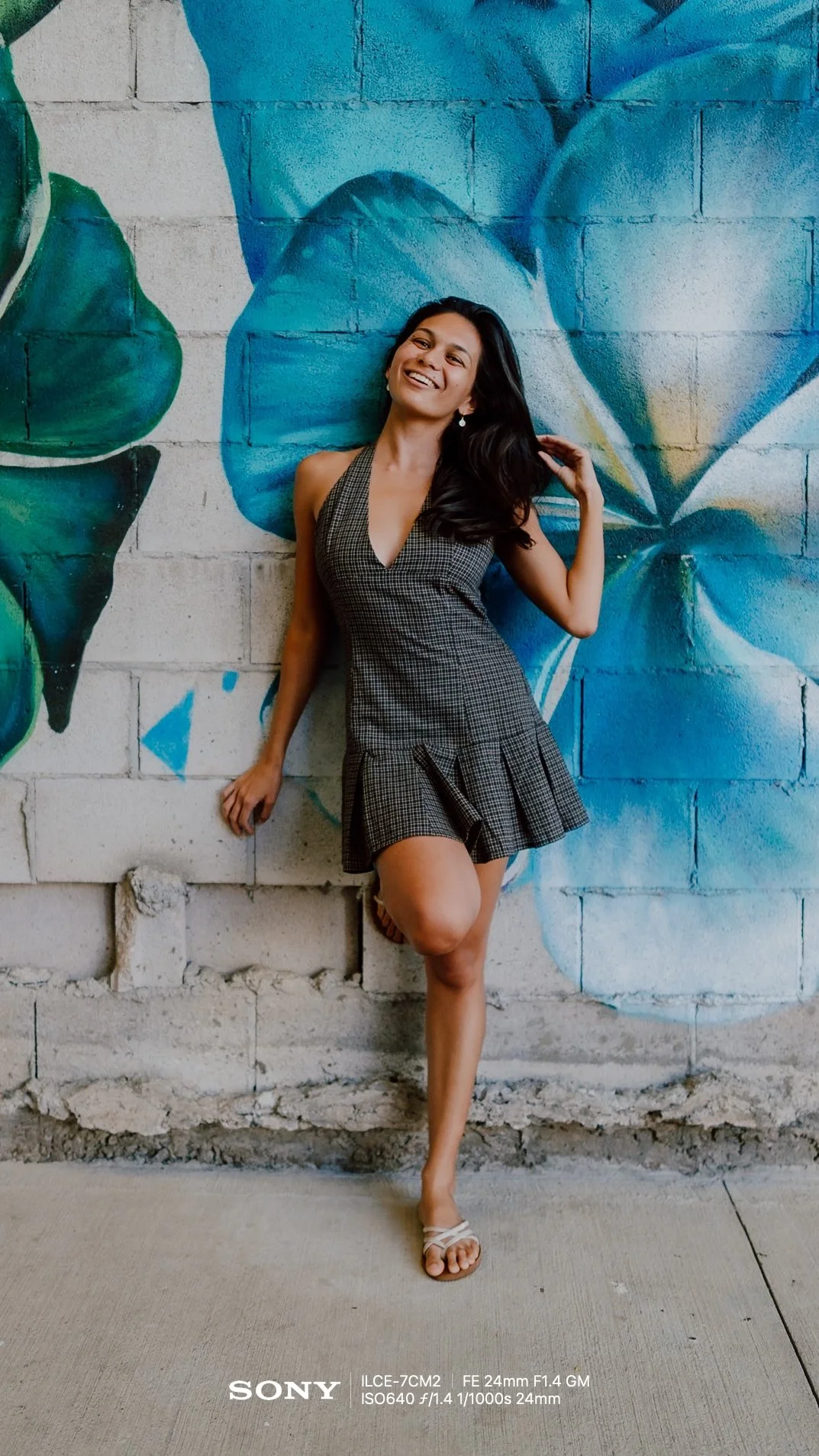  Relaxed Arms (V2)    “Stand tall and let your arms hang naturally by your sides. Laugh away from the camera as if a friend just told you a good joke.”  Women, Standing, 🌆 City, ✨ Advanced, 24mm 