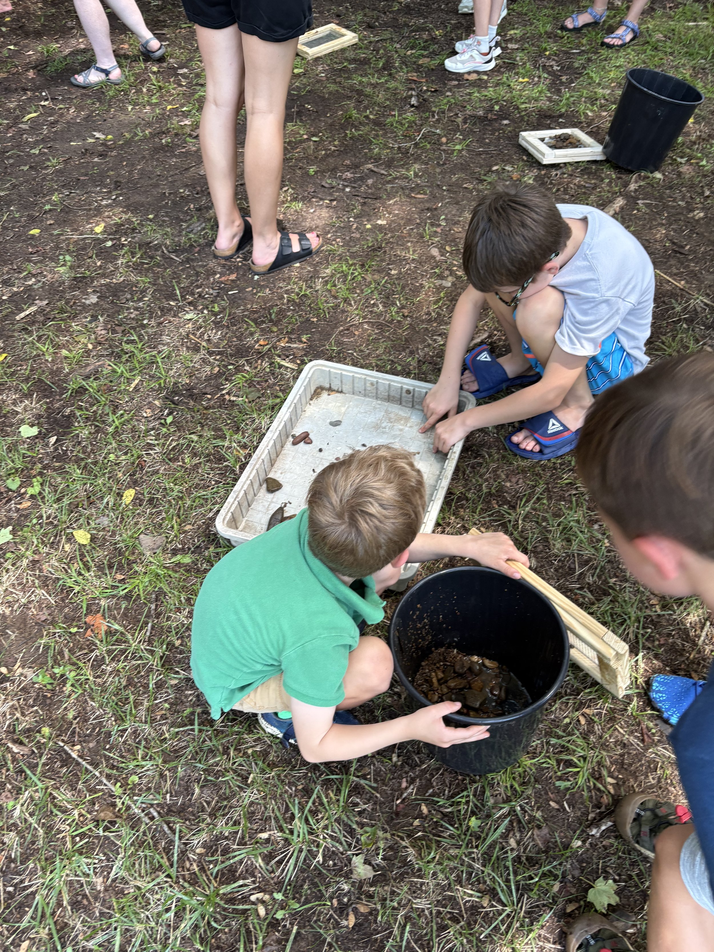 children learn about living soil by sorting through to find how it works