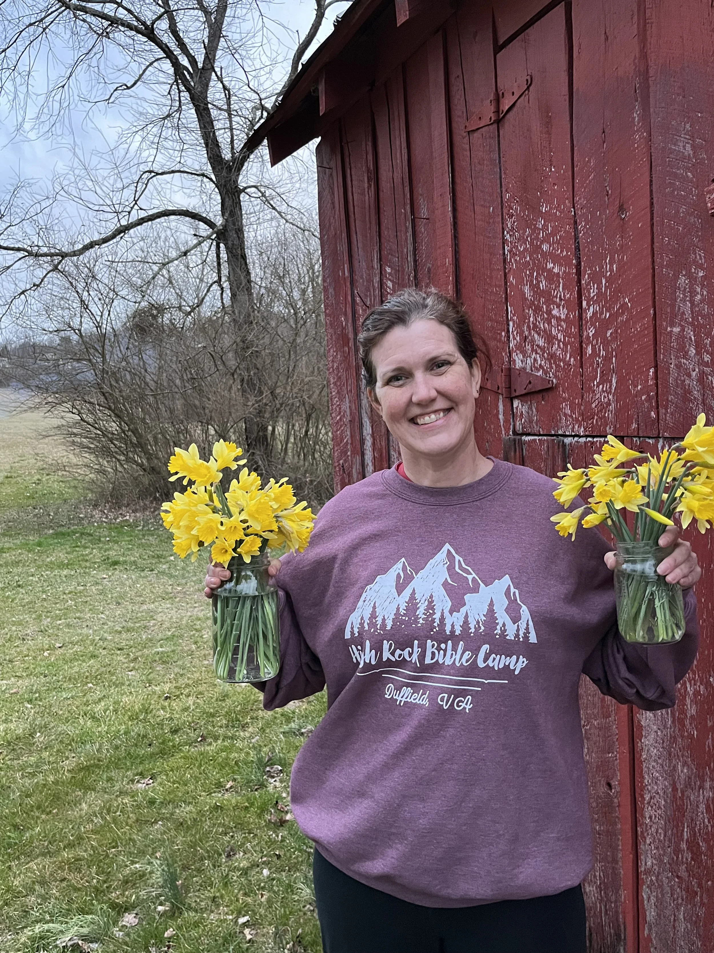 the farmer with her first flower harvest of daffodils
