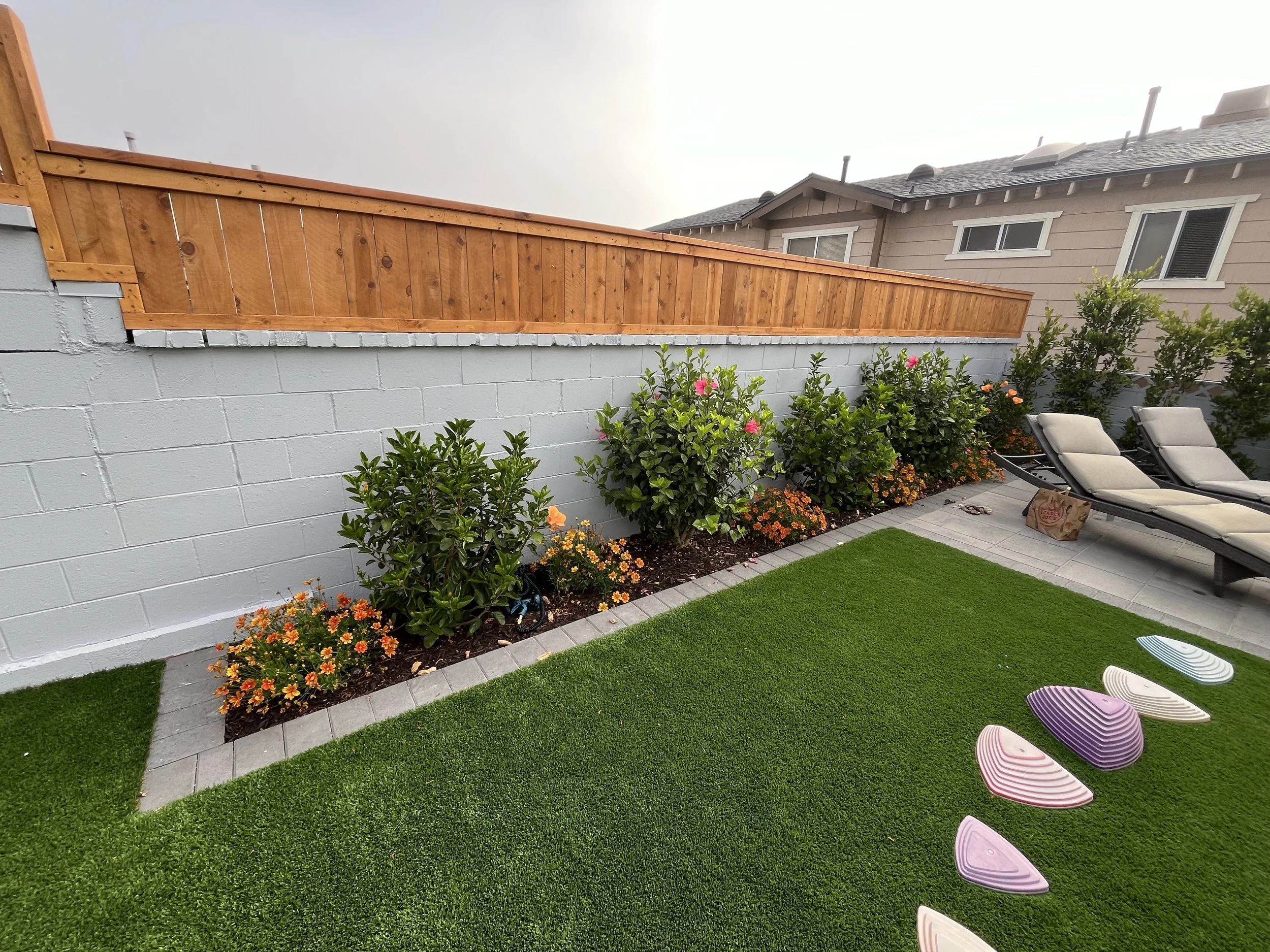 brick block wall and wood fence long beach , ca