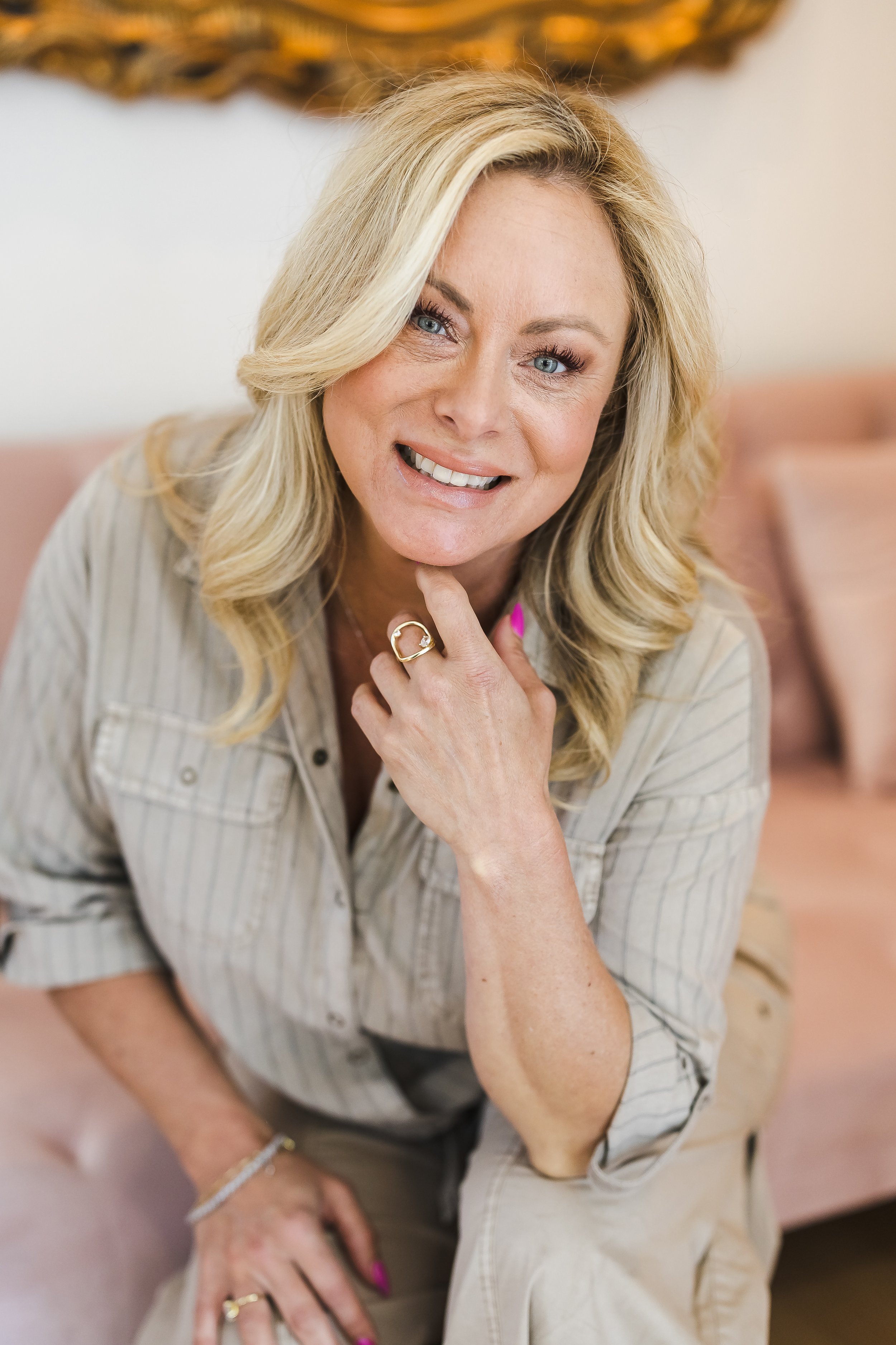 Silhouette of a person with curly hair in motion against a light background.