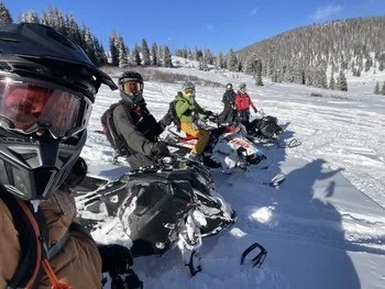 Group of snowmobilers in Colorado in an intro to Backcountry snowmobile course by Powder Pro Lab
