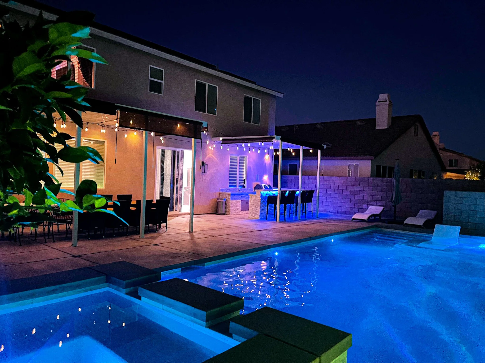B9 - Blue-lit pool and house at night.jpg