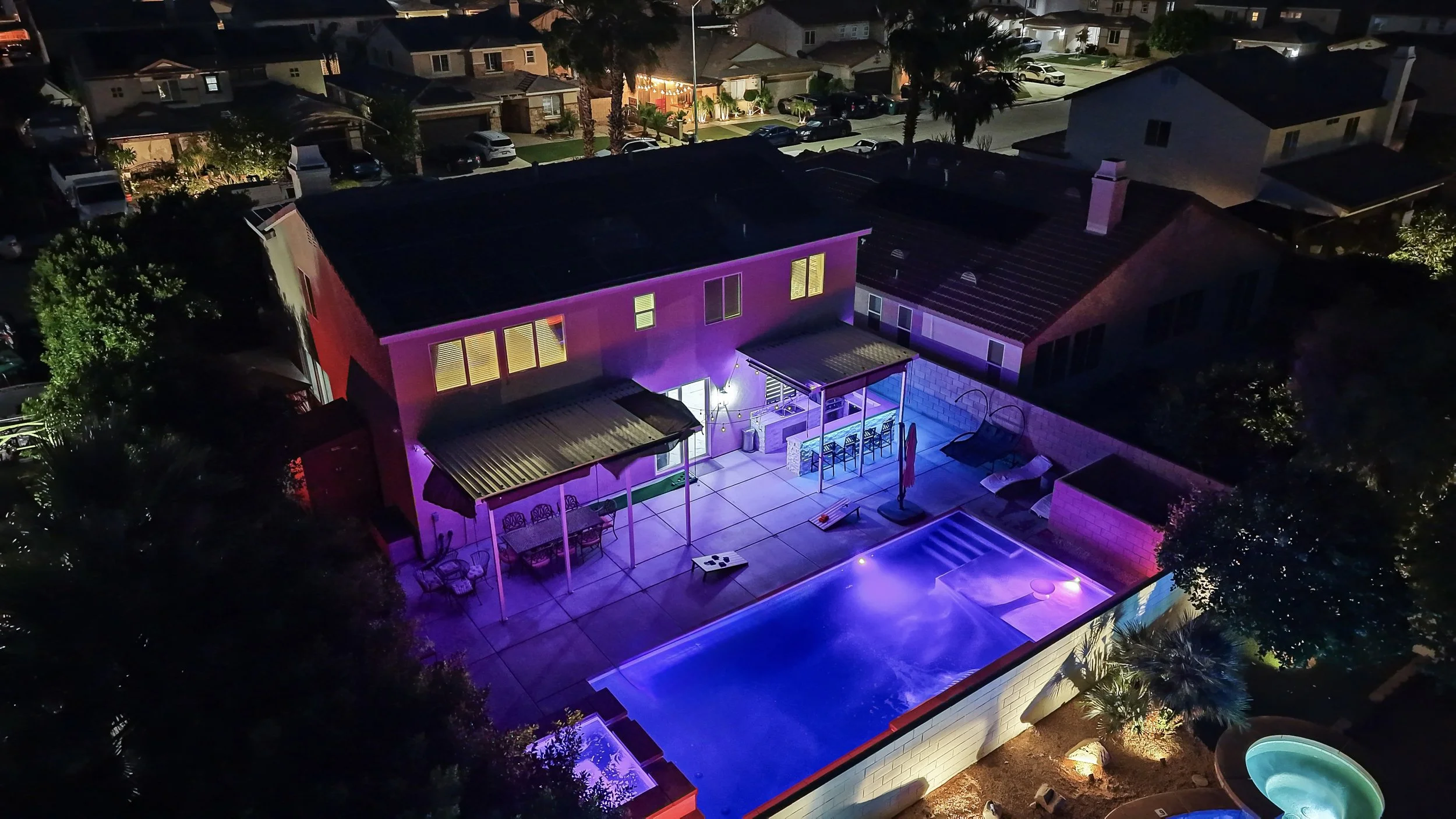 B6 - Pool and patio aerial angle at night.jpg
