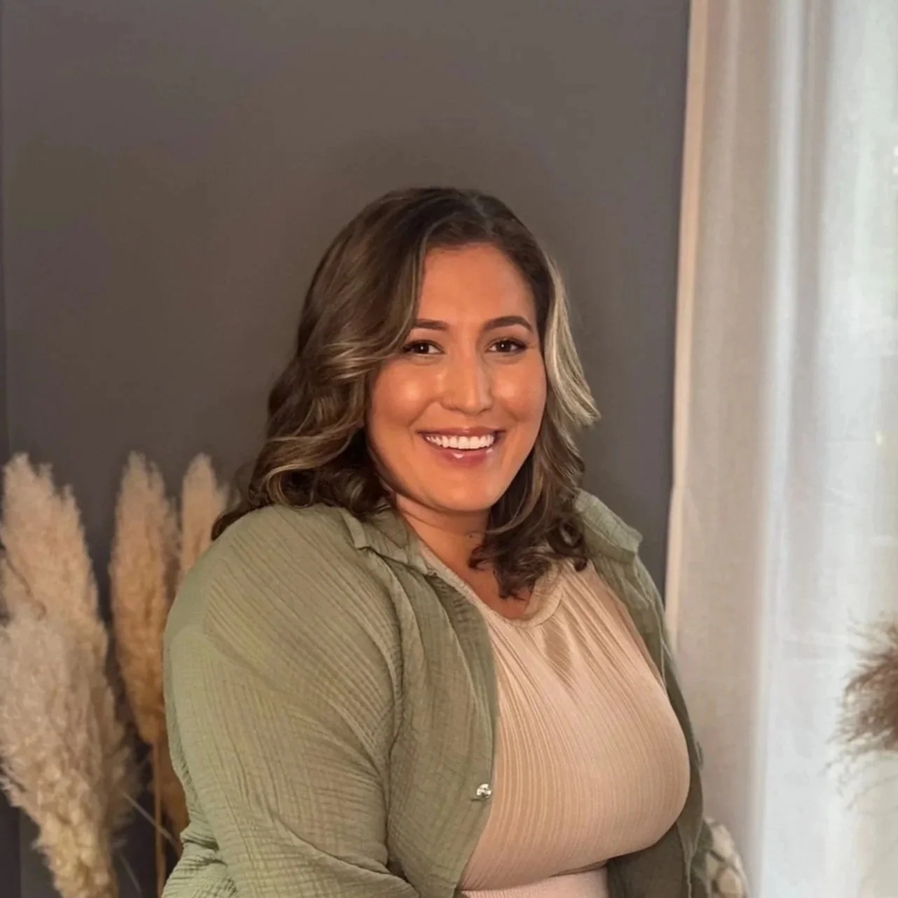 Krysta Halas, LCPC, founder and licensed clinical professional counselor at Peace in Counseling in Naperville, Illinois, smiling in a professional headshot.