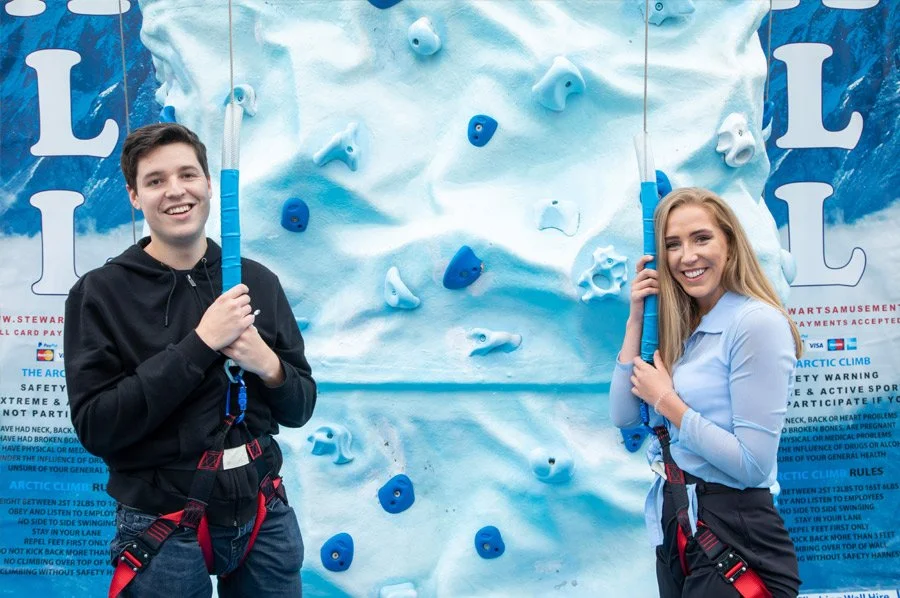 2 people wall climbing