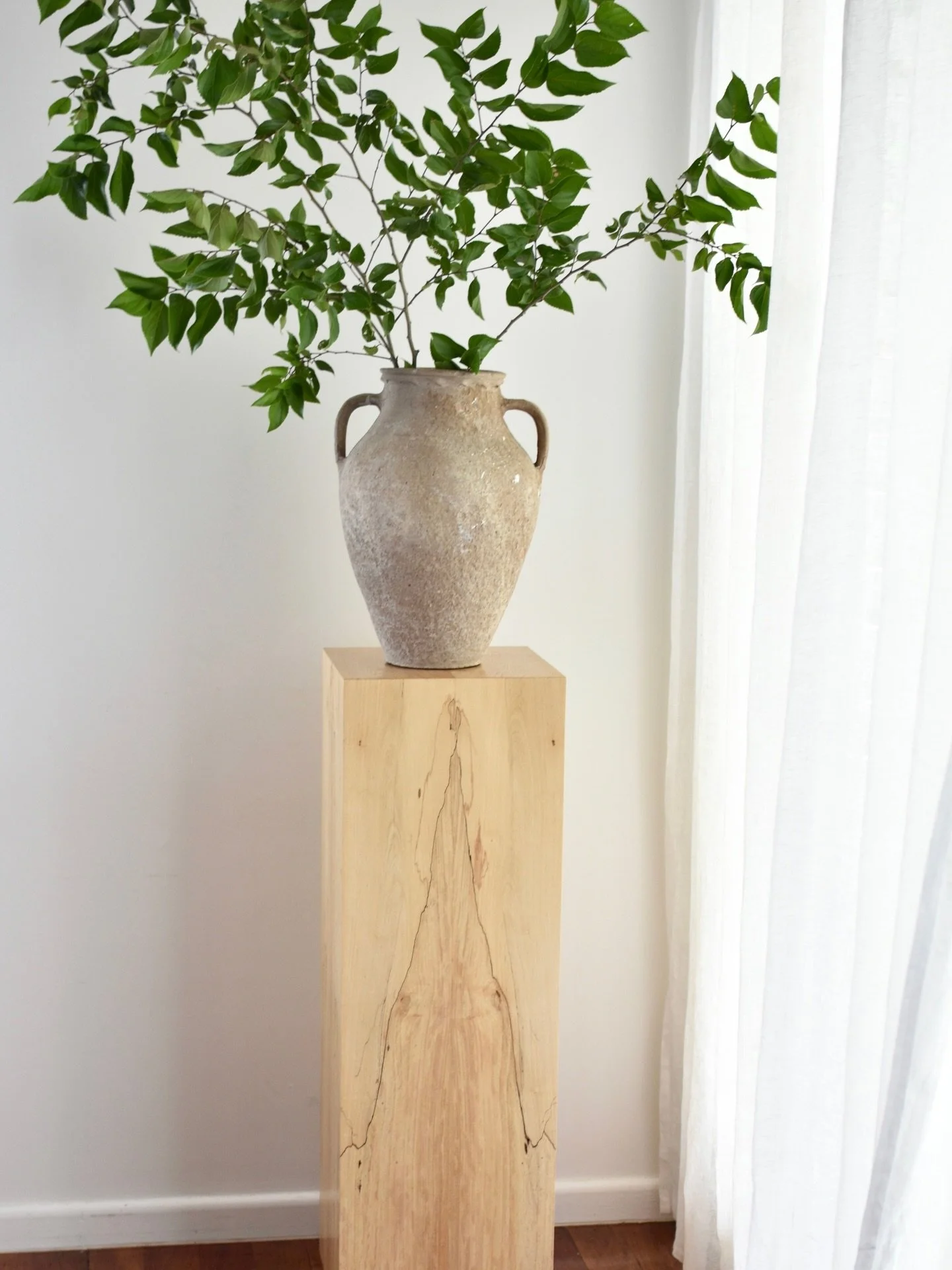 Filling the empty corner:
A plinth is one of those design elements that can completely transform a space. It brings height, dimension and subtle tone, while adding a sense of refinement and intention.

Whether styled with sculptural decor, a ceramic 