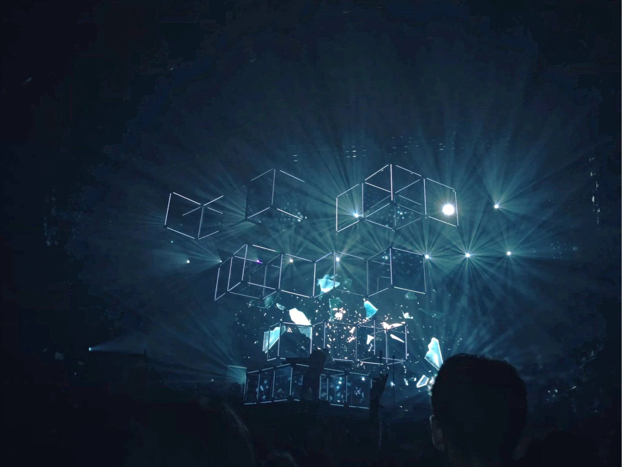 Blue-lit art installation high above festival crowds