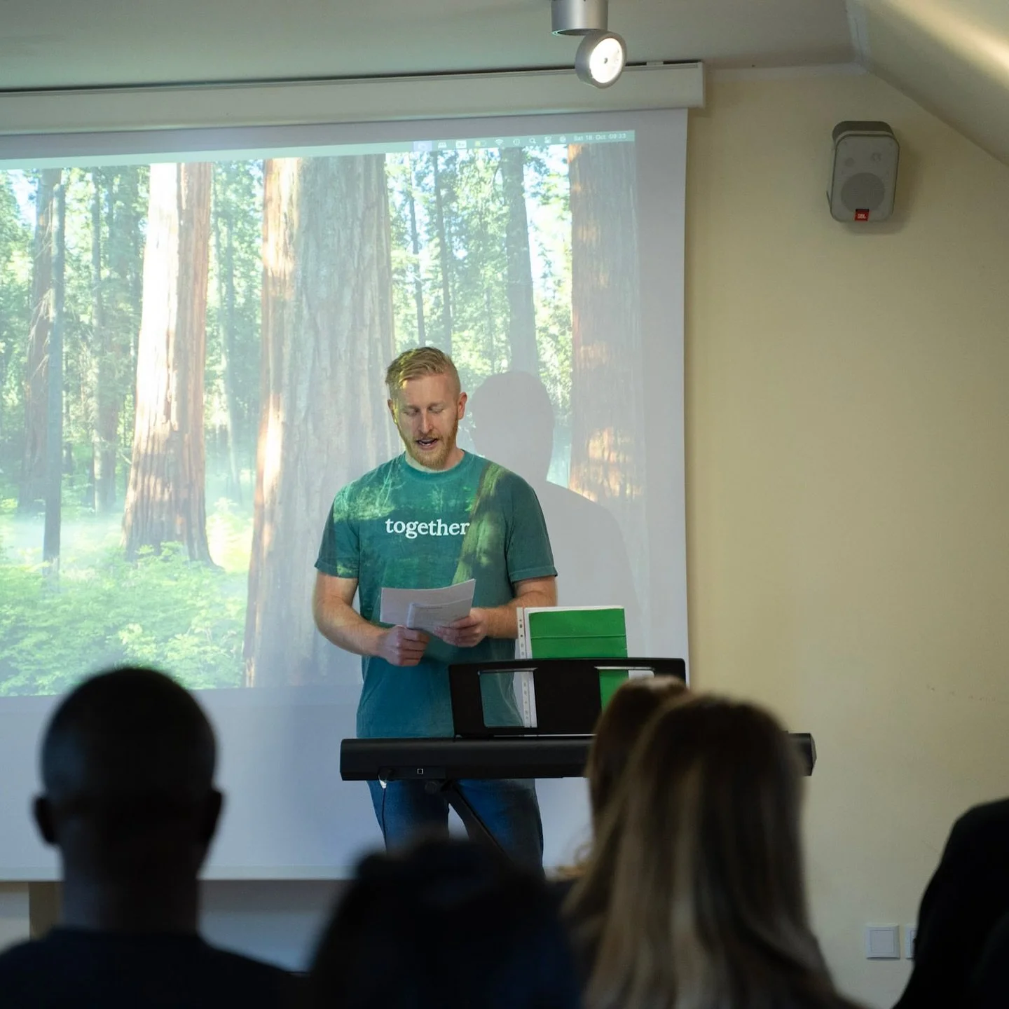Pastor Taylor Whitley preaching a sermon at International Church Berlin, a welcoming English-speaking church in Berlin Prenzlauer Berg.