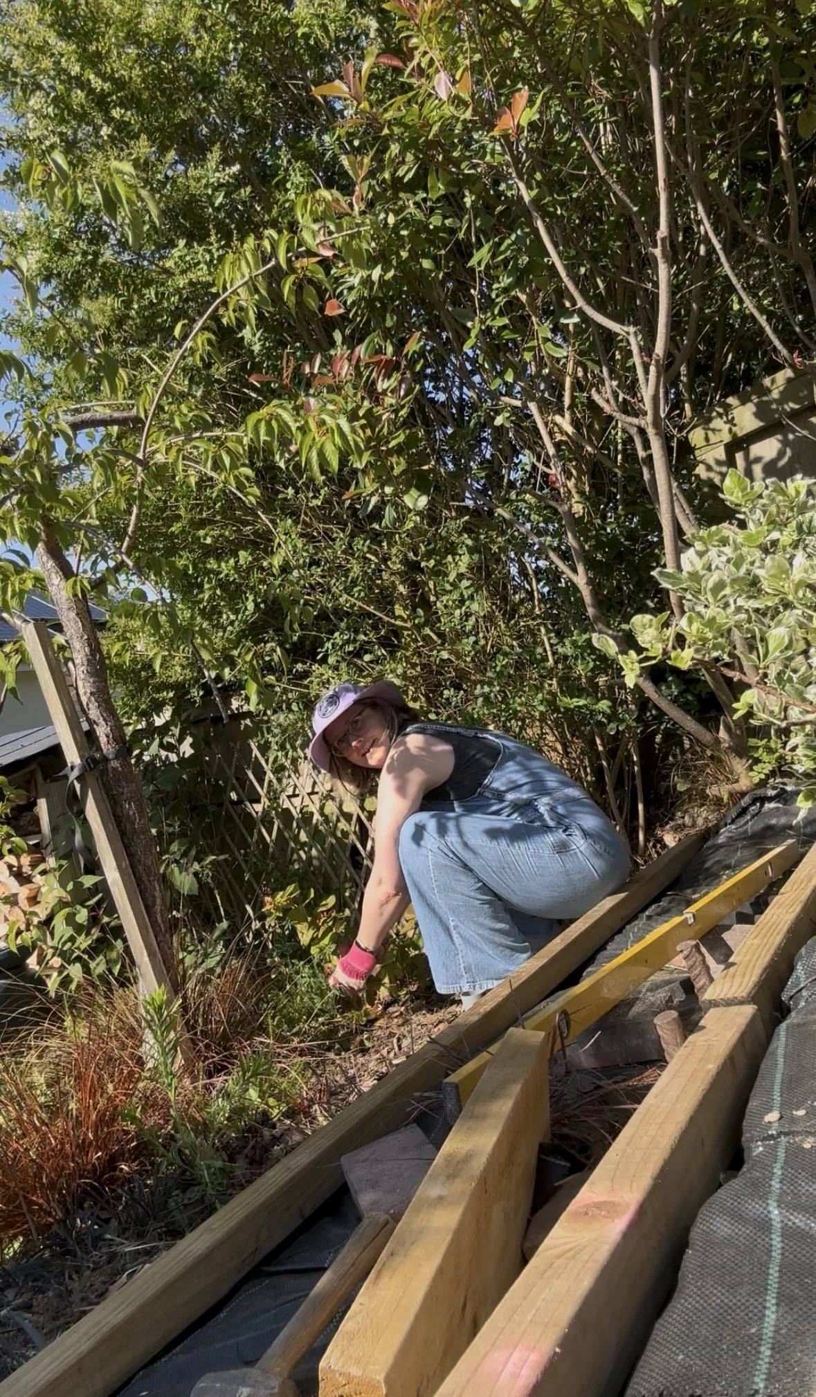 Ruth is gardening in a Yoga squat position
