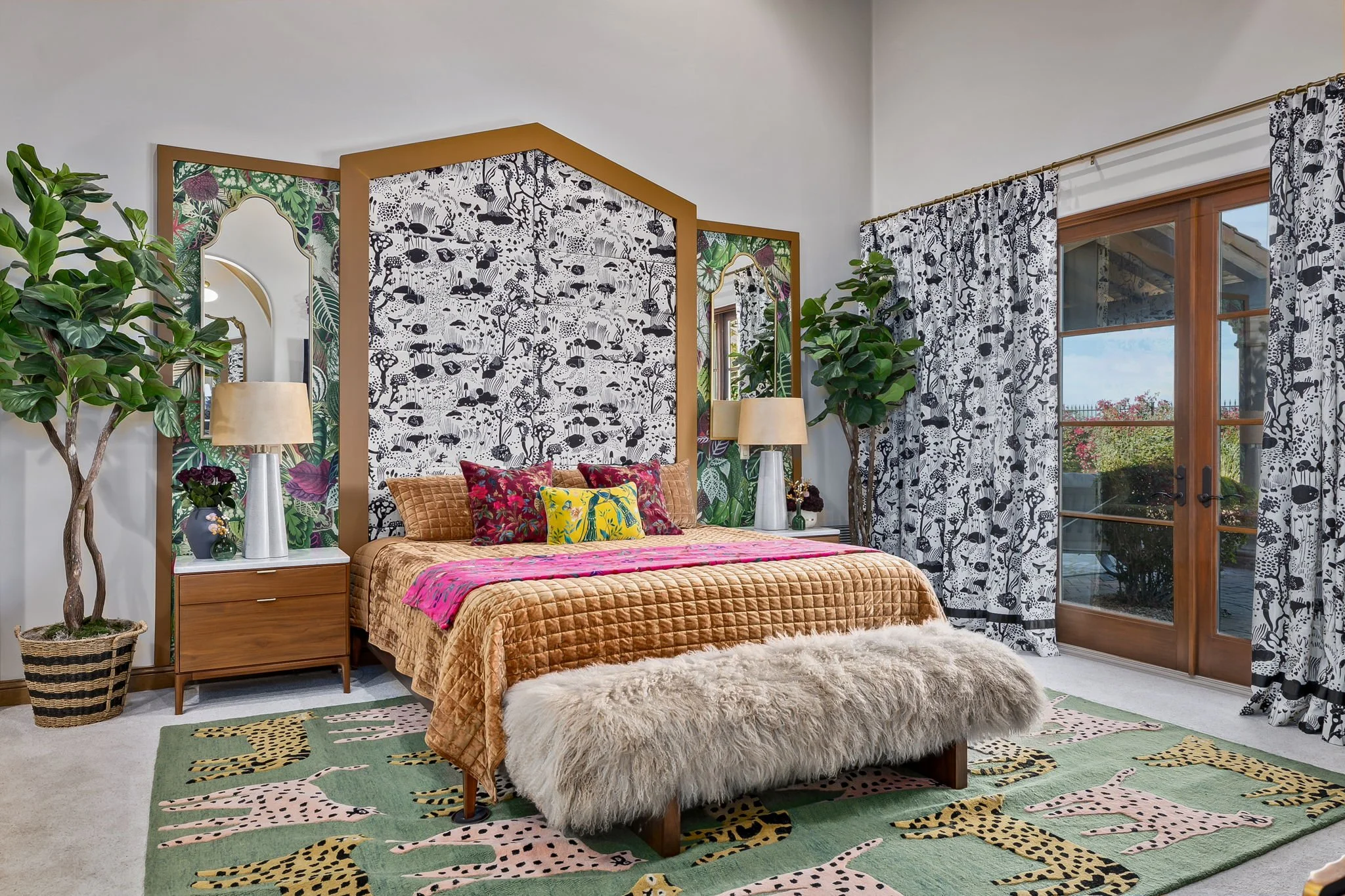 Maximalist primary bedroom with a custom triptych headboard, leopard print rug, and velvet bedding by Red Carrot Design in Gold Canyon, AZ.