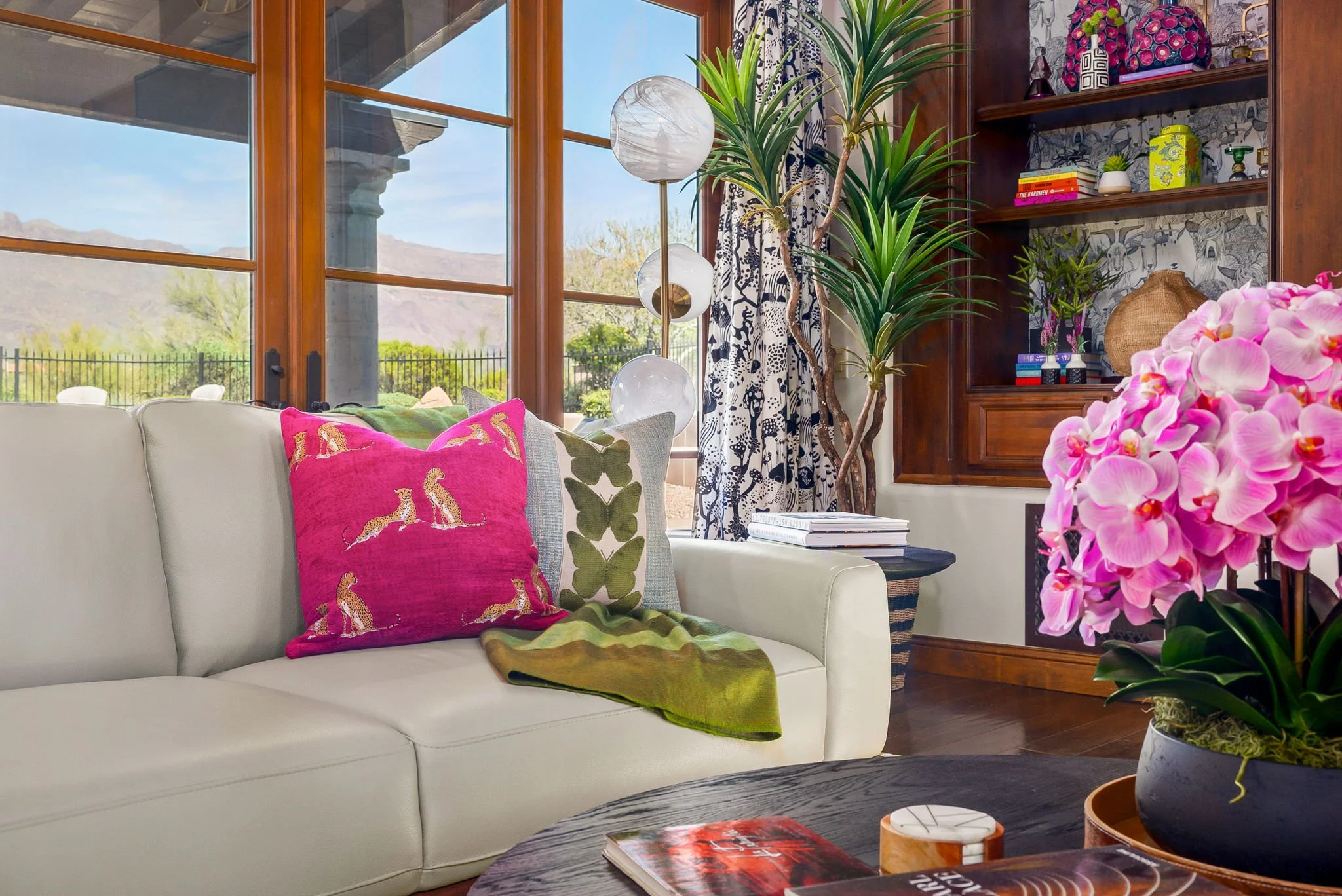 Upscale living room decor featuring leopard print pillows and custom drapery in Superstition Mountain Golf Community, Gold Canyon, AZ, by Red Carrot Design.