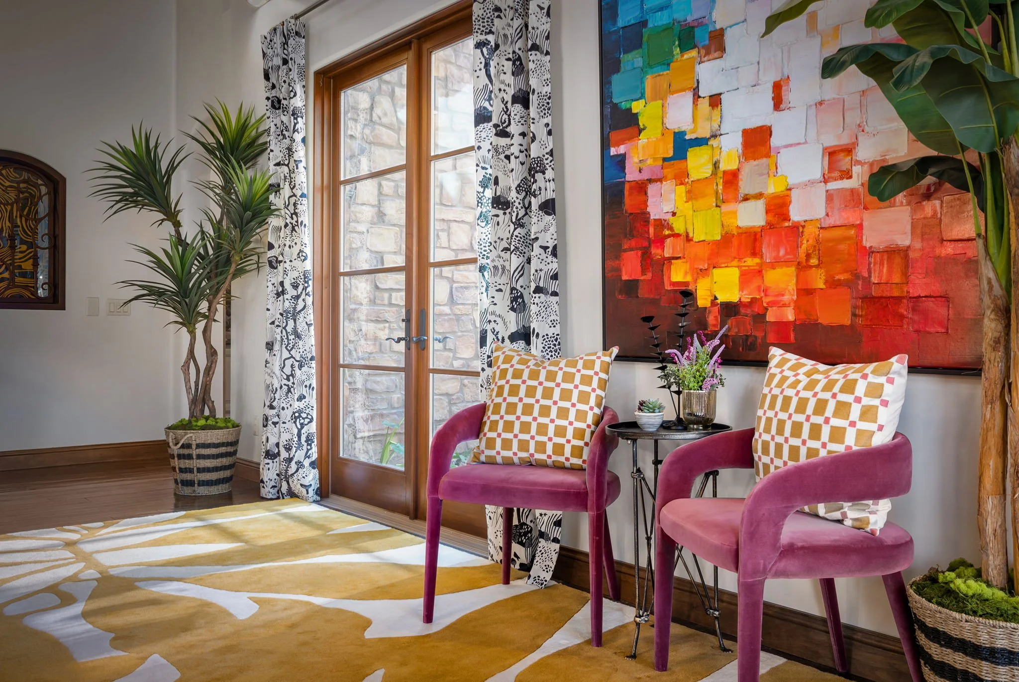 Modern velvet accent chairs and vibrant abstract art in a Gold Canyon, AZ, home redesign by Red Carrot Design in Superstition Mountain.