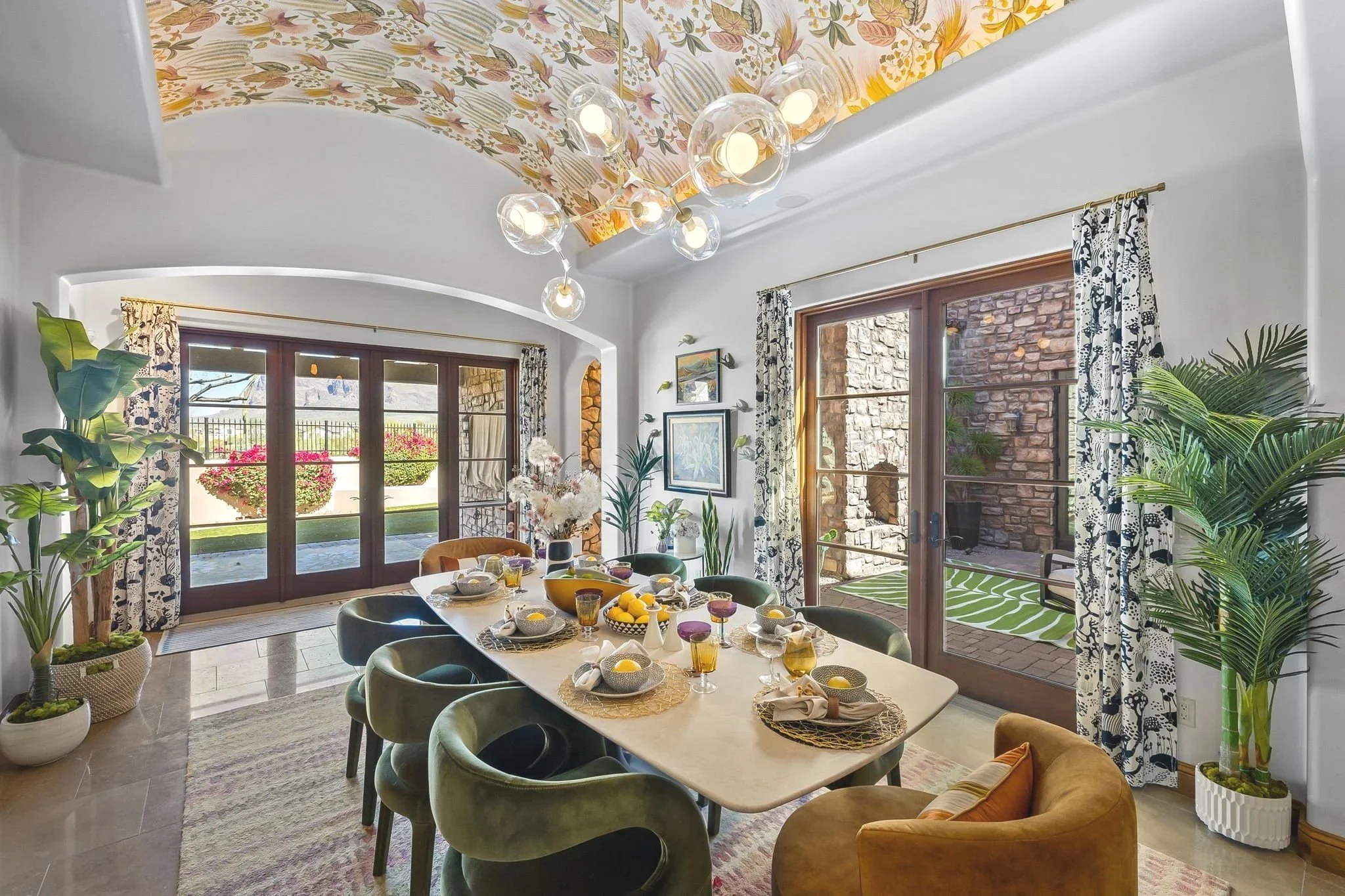 Modern dining room redesign by Red Carrot Design in Superstition Mountain Golf Community, Gold Canyon, AZ, featuring a floral vaulted ceiling and globe chandelier.