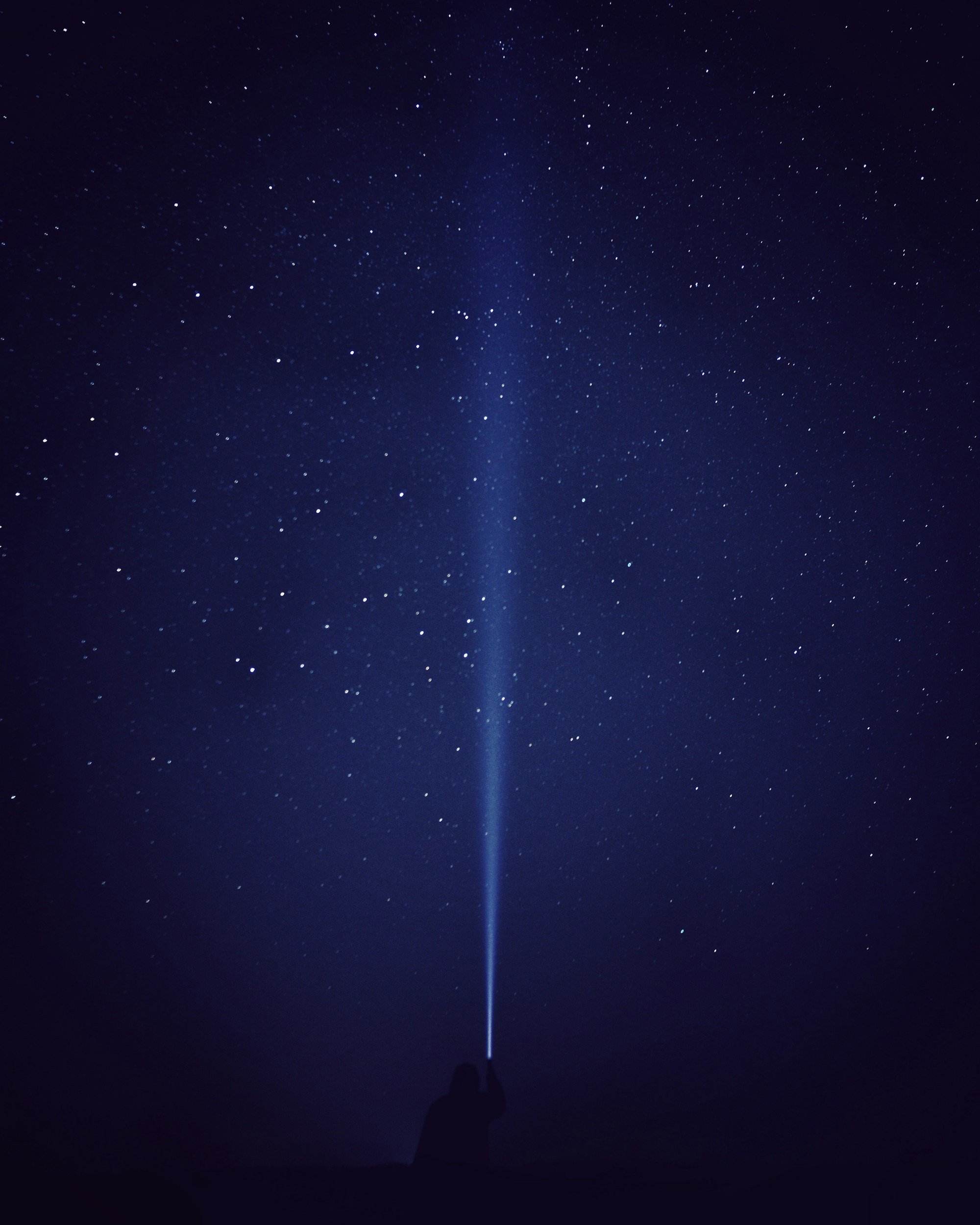 Spiritual connection and intuitive healing beneath a star-filled night sky.