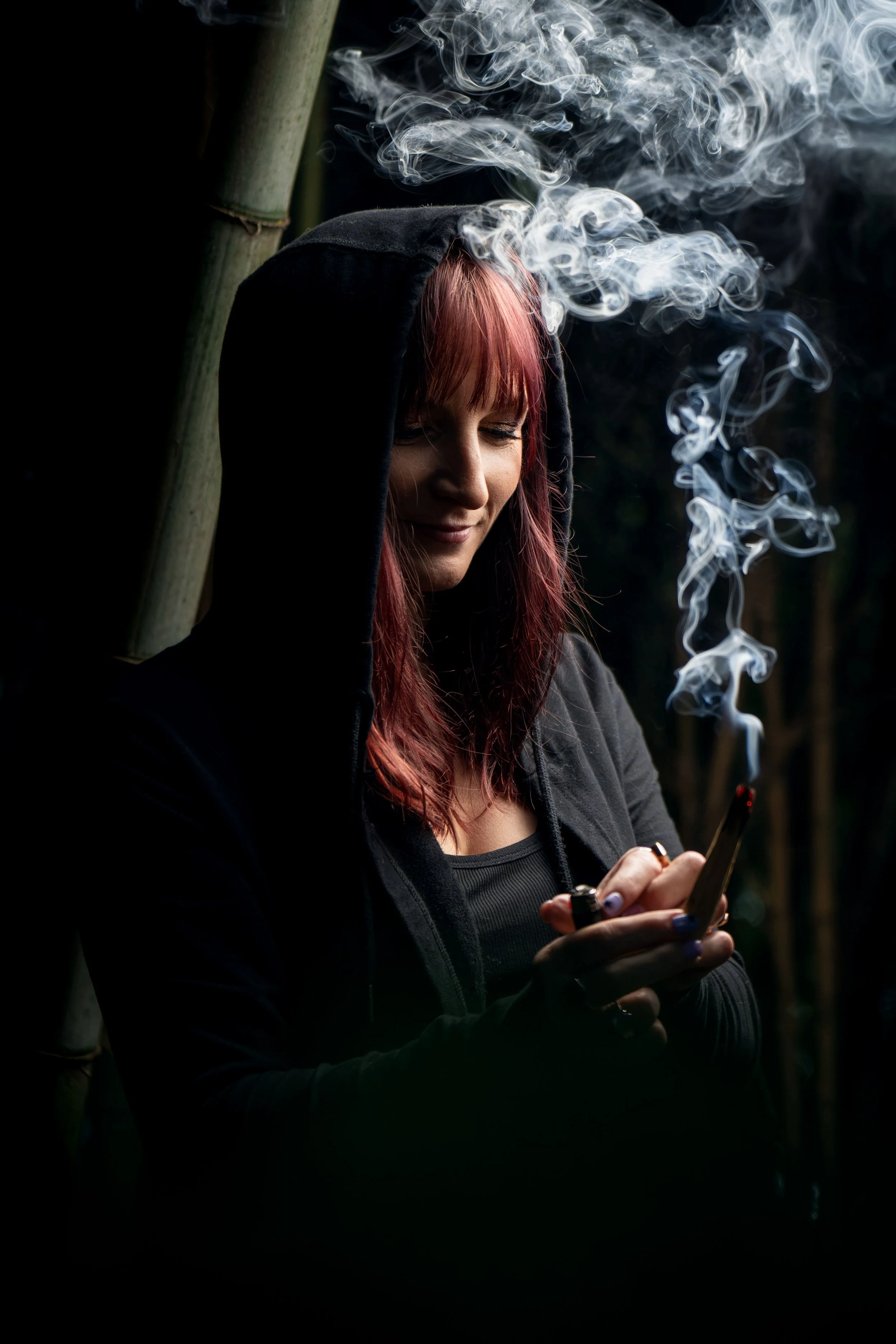 Lorijane holding incense during an energy healing ritual
