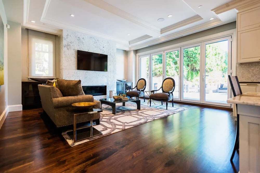 living room with floor-to-ceiling windows and marble fireplace