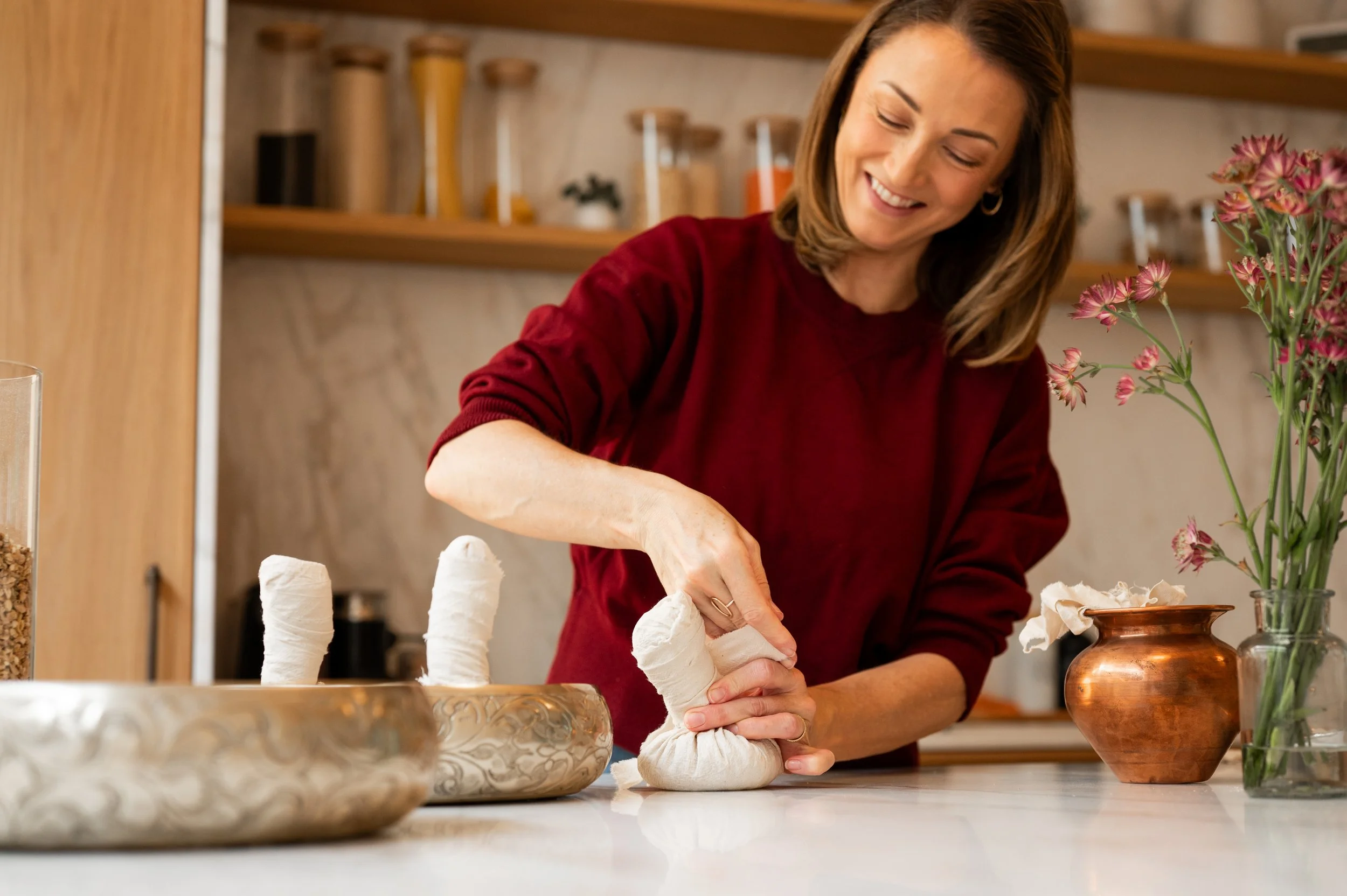 Preparing herbal boluses for Pinda Sweda treatment in the practice kitchen