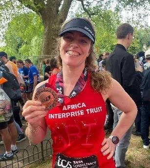 London Marathon runner holding medal