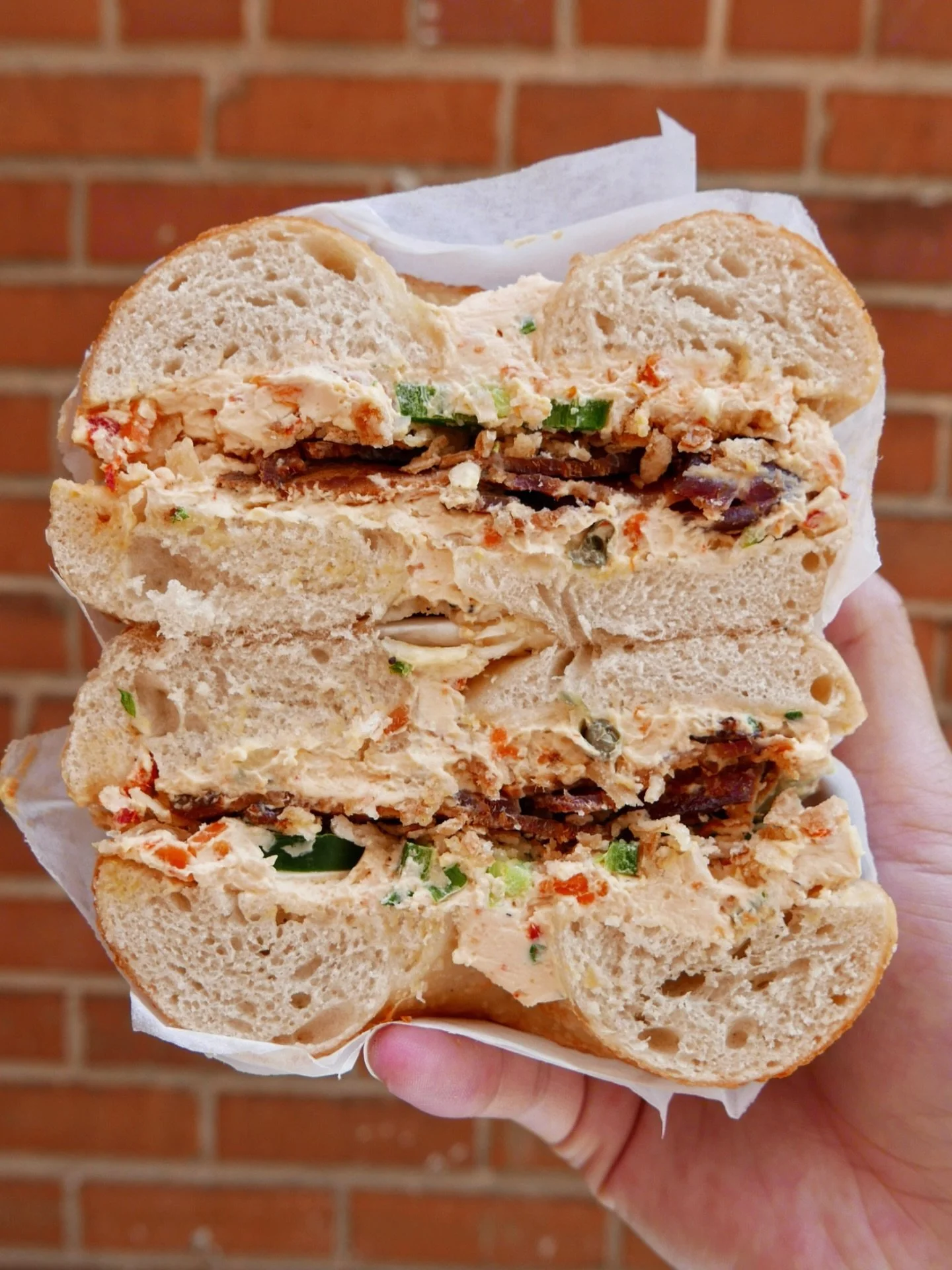 ::knocks on door:: good morning. do you have a moment to speak with us about our friend THE QUEEN&rsquo;S POINT? She&rsquo;s STACKED to the ceiling with crispy bacon, roasted veggie cream cheese, jalapee&ntilde;ies &amp; crispy cronchy shallots on a 