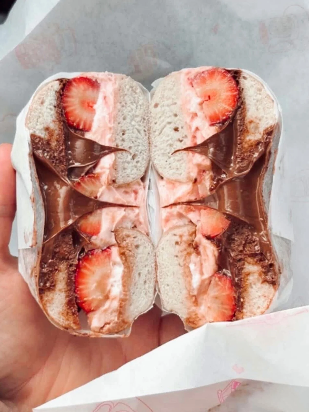 For anyone dealing with anxiety or seasonal depression, plz know there&rsquo;s someone who loves you. And that someone is a bagel sandwich named 🌹THE ROSE COURT🌹 🍓 swirl cream cheese, @nutella + fresh strawbs on a toasted pretzel daddy 🫨😮&zwj;💨