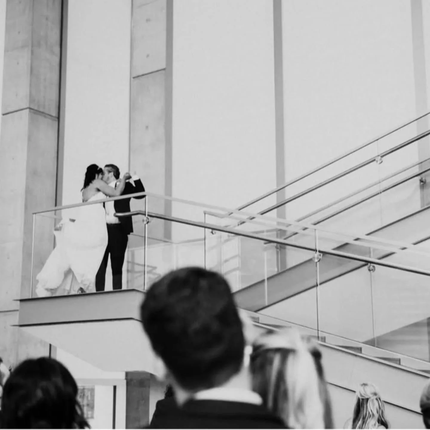 Throw Back of Sarah and Shawn's wedding from May 2018! 

This photo has ALWAYS been a favorite of ours. These two cuties share a moment together, stealing a kiss without a care in the world. 💋 So adorable!

We LOVE the candid photos during a wedding