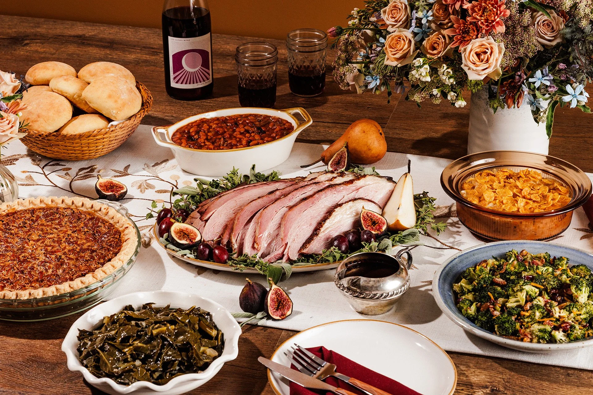 Martin's Ham Gathering package with sliced smoked ham, turnip greens, hashbrown casserole, broccoli salad, baked beans, and pecan pie.
