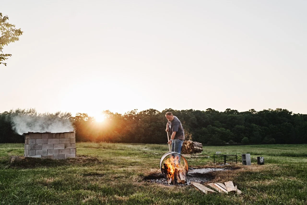 Pat tending to the barbecue pit