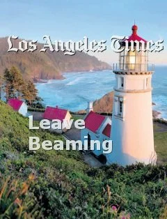 Image of a white and red lighthouse along a rocky coastline and blue ocean water with the text Los Angeles Times and Leave Beaming.