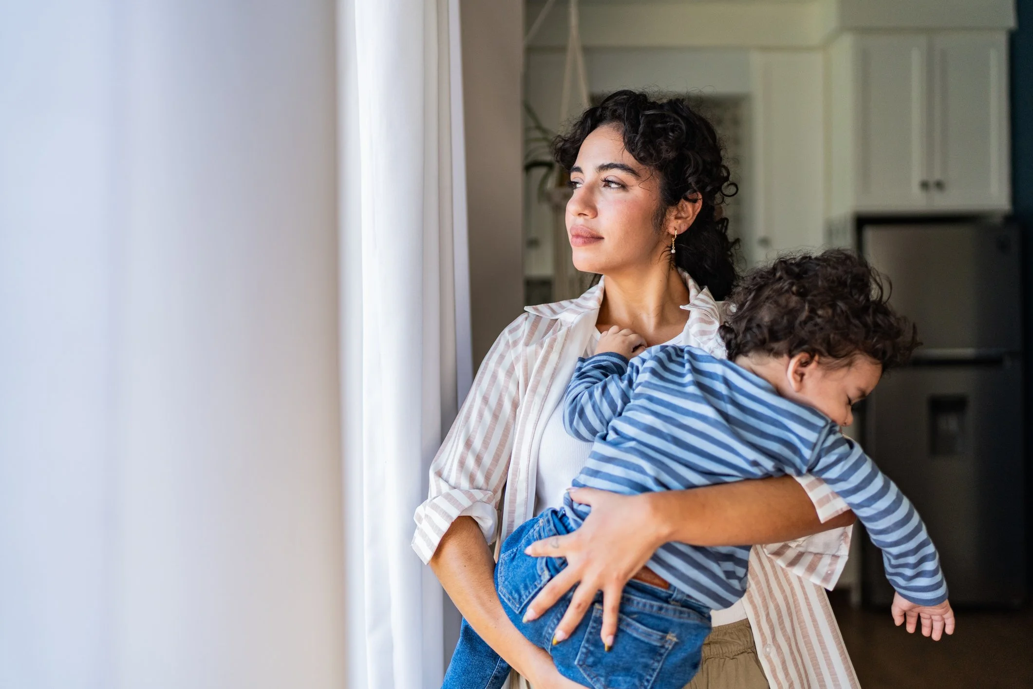 Woman smiling and present representing reconnecting with identity through therapy for motherhood burnout in Ohio.