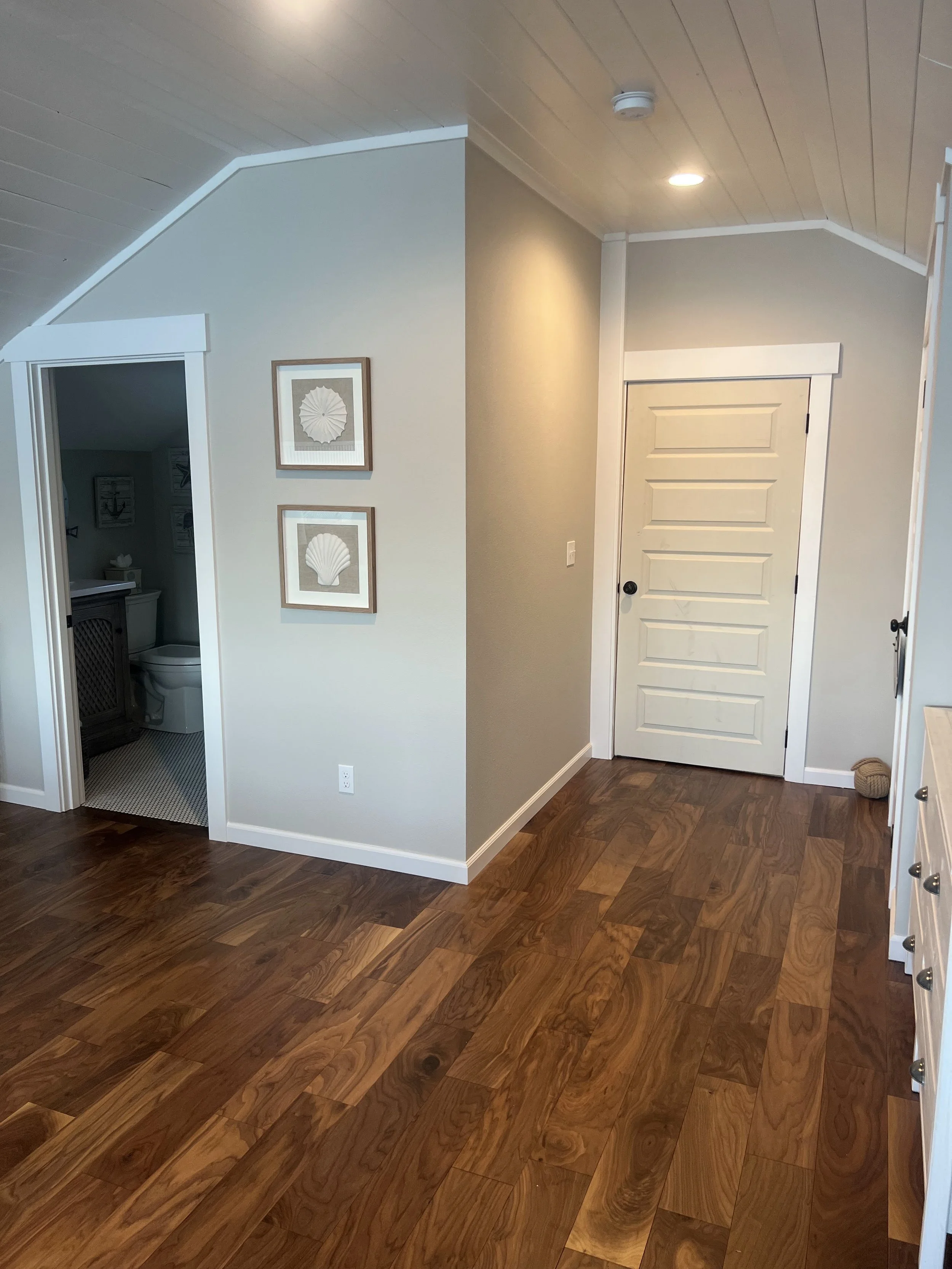 Home remodel in Lakebay, WA with wood floors and freshly painted walls and millwork.