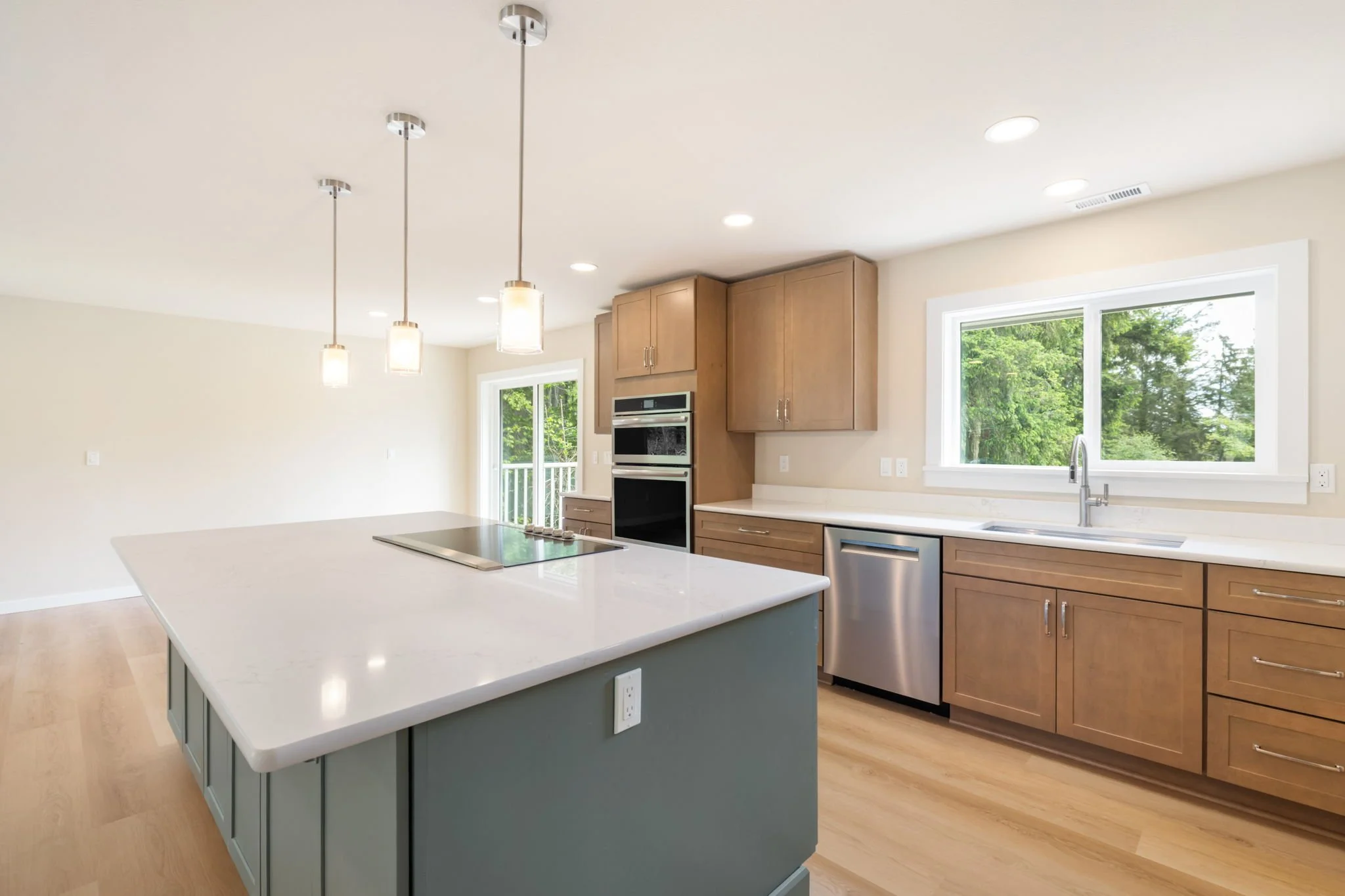 Fox Island, WA kitchen remodel with stainless appliances and island with built-in range.