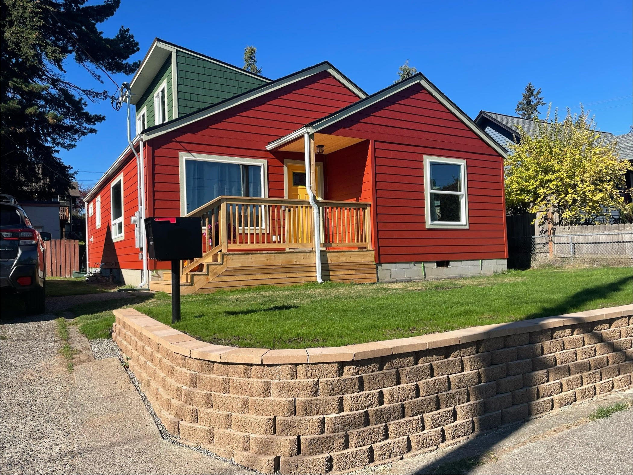 Exterior repairs to home in Bremerton, WA with new siding, new front door, and new front porch.