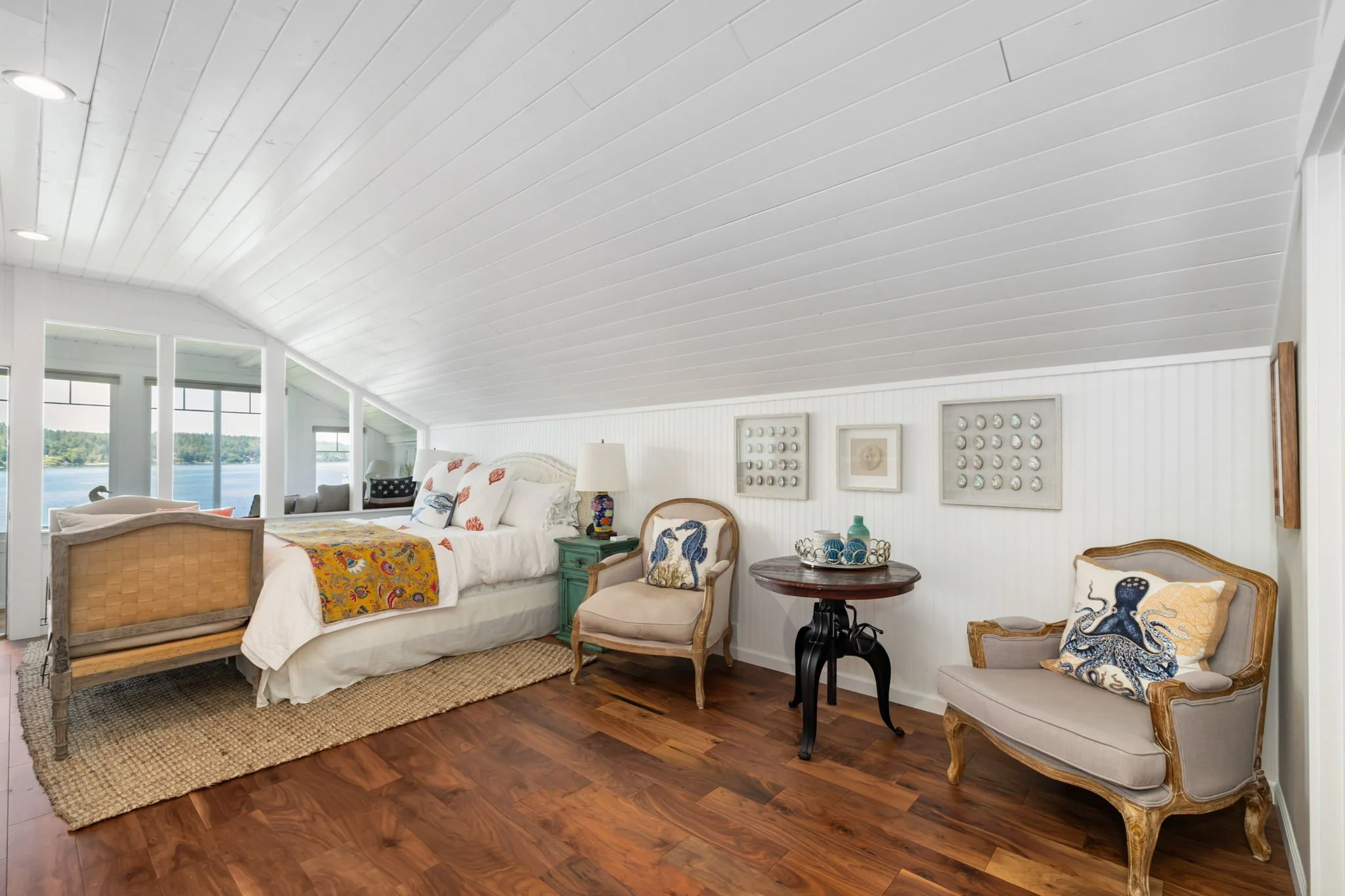 Lakebay, WA beach cottage remodel with sloped planked ceiling and vinyl flooring.