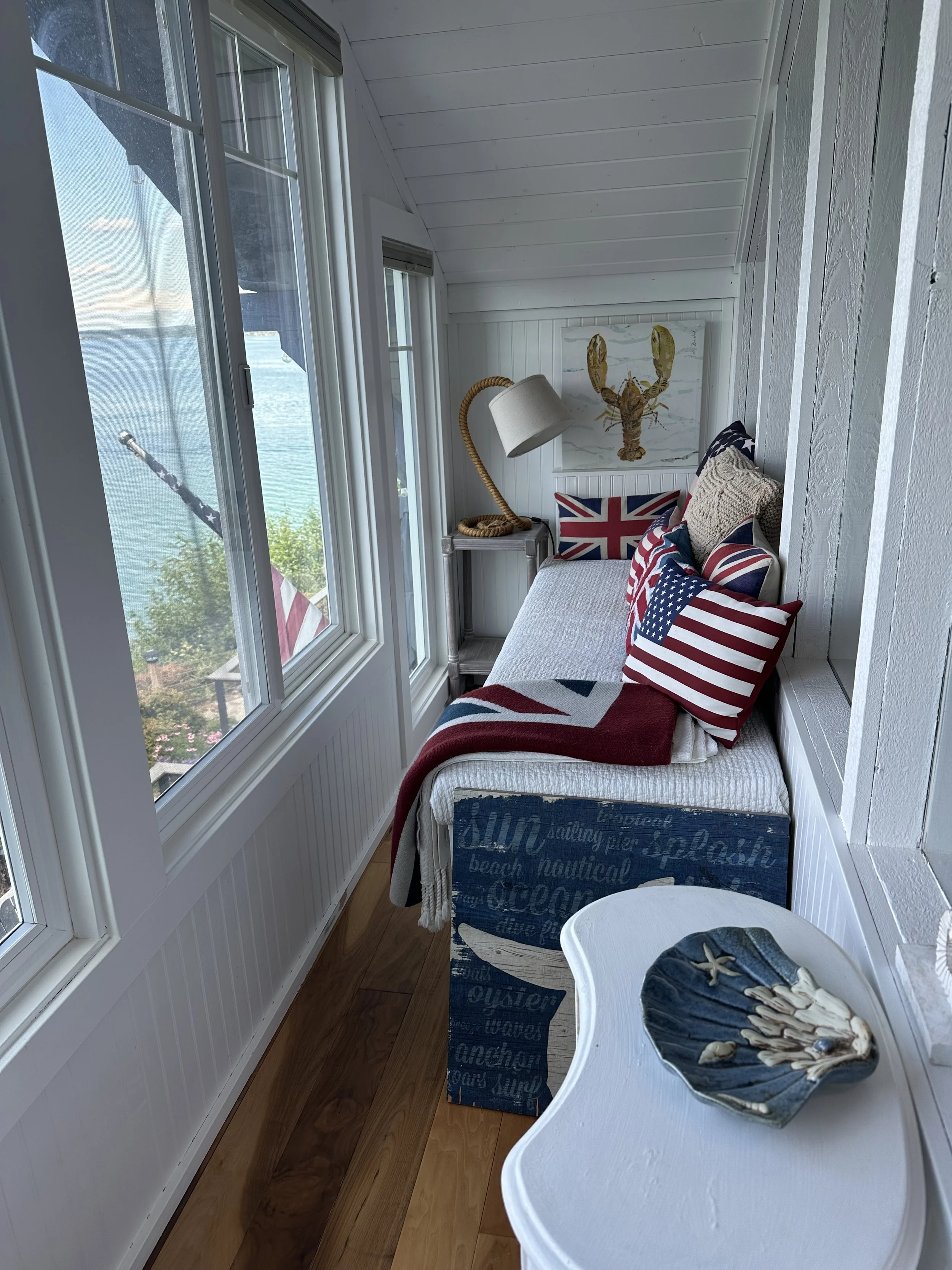 Sun room remodel in beach cottage in Lakebay, WA with windows and water view.