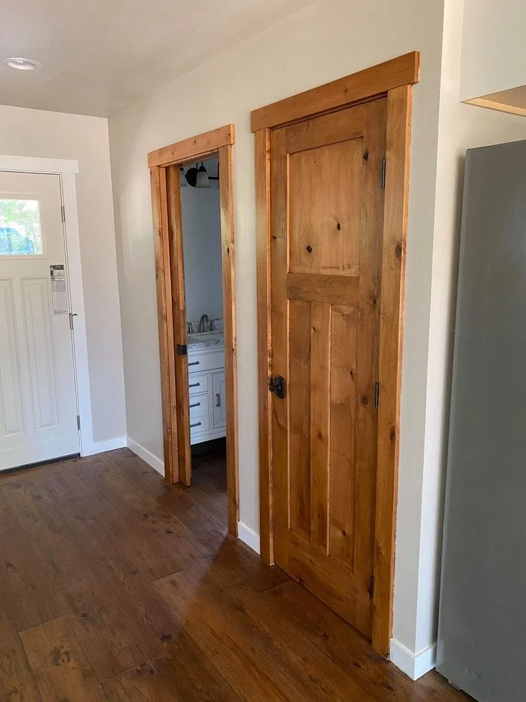 New wooden interior doors with matching doorframes.