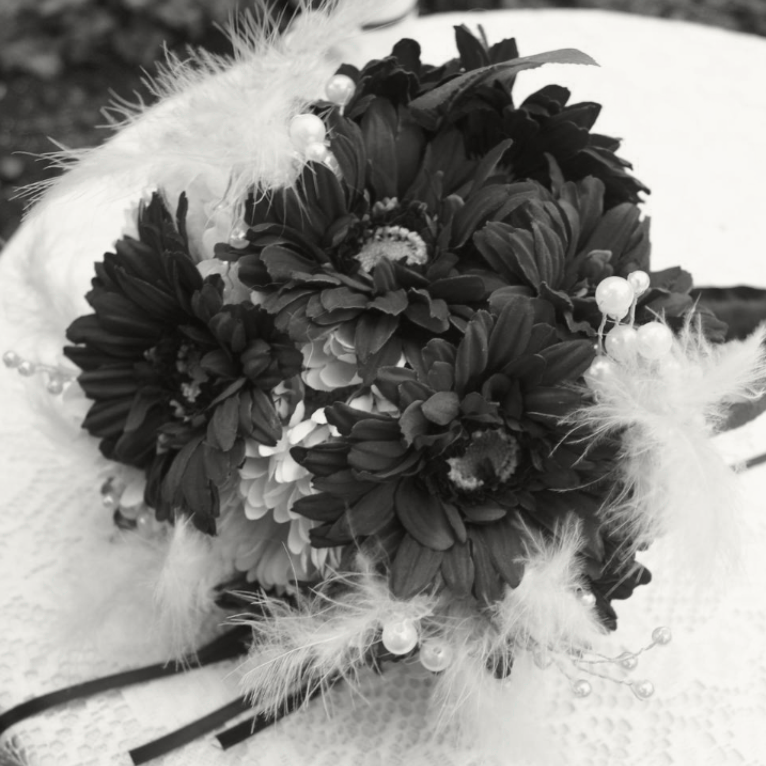 Bridal wedding bouquet of gerbera daisies lying on a table. Photo credit: Teresa Idle
