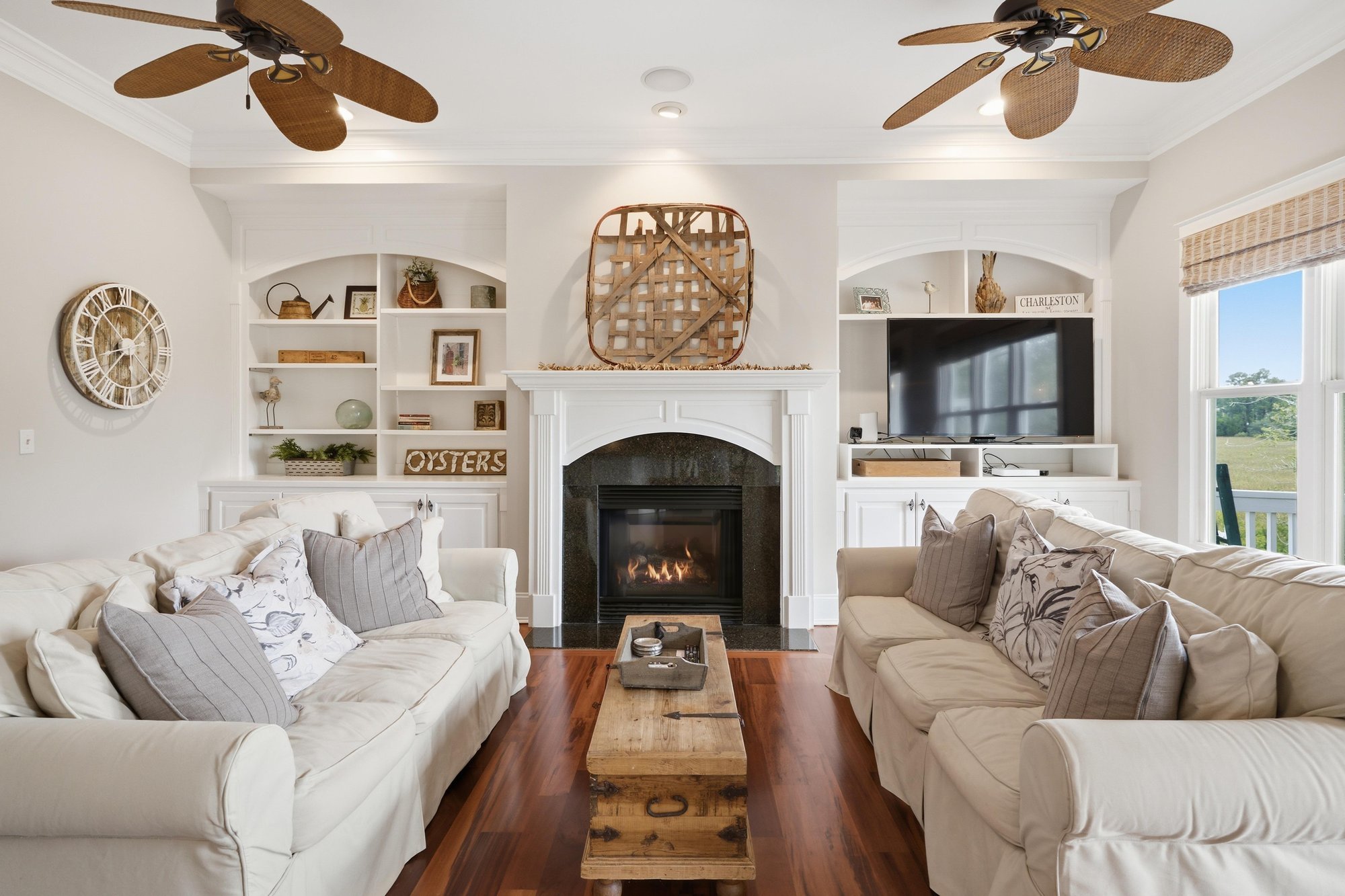 Living room with a fireplace and built ins in The Point at RiverTowne, Mount Pleasant