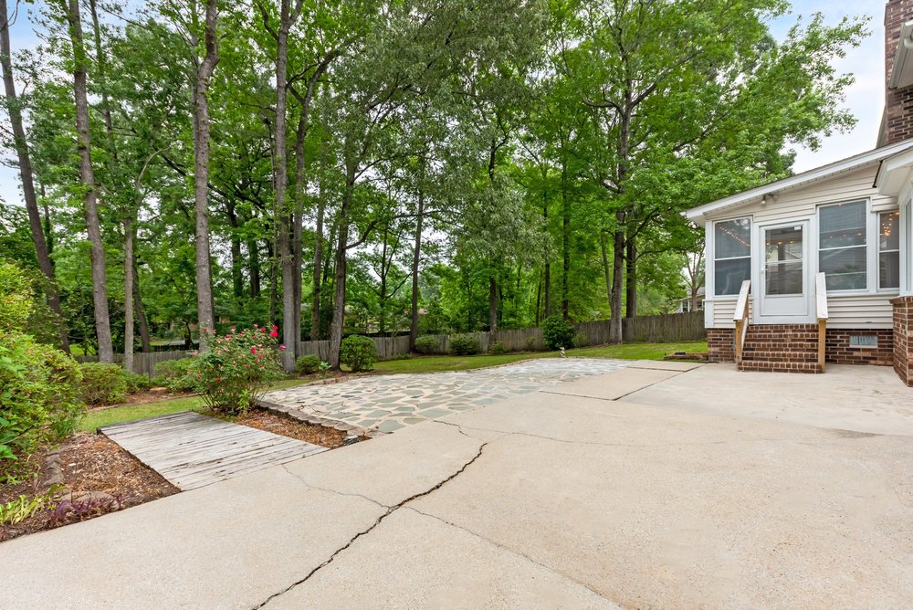 Bare backyard patio before editing