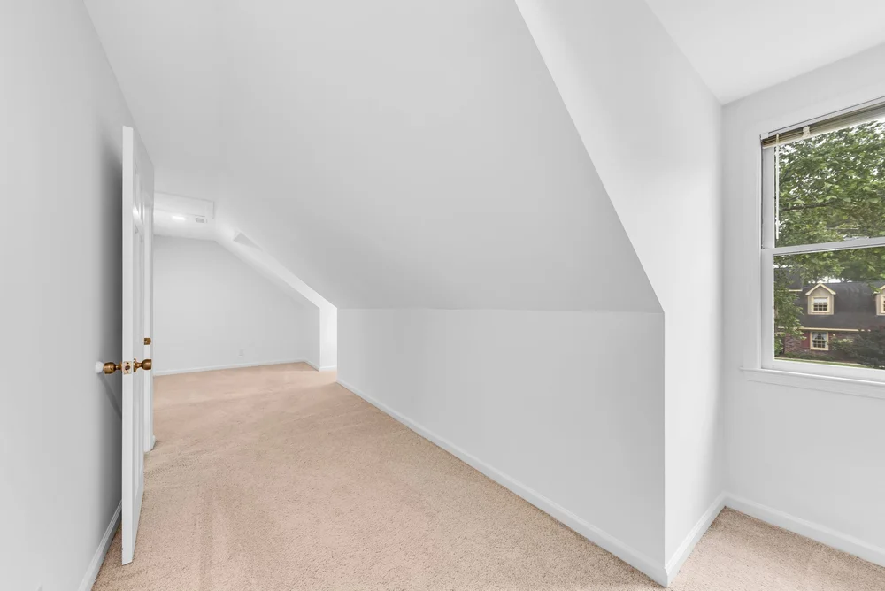 Empty attic room before virtual staging