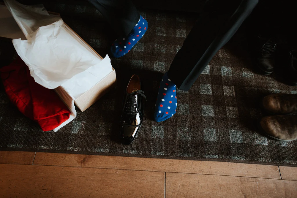  A groom gets his shoes ready. 