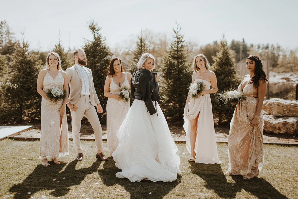  The bride poses with her Just Married jacket. 