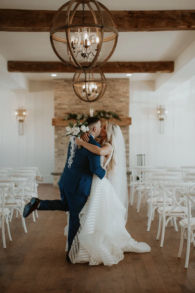  The bride and groom kiss. 