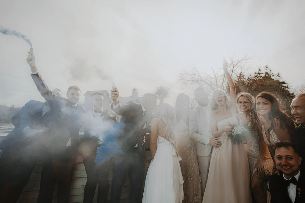  A wedding party sets off smoke bombs for the big day. 