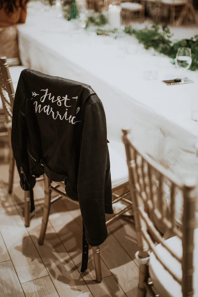  #TheJustMarriedJacket sits on a chair. 