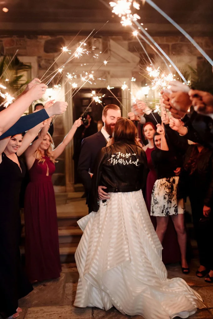 The bride and groom are showered with celebrations and fireworks after they seal the deal.