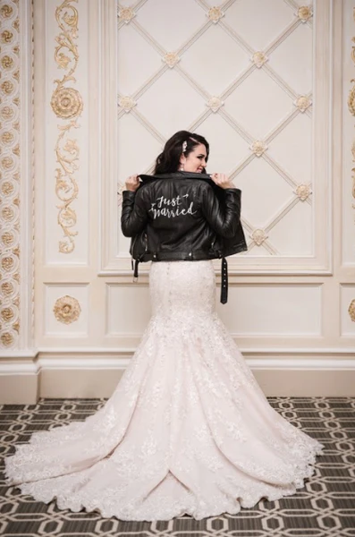 The bride shows off her look featuring #TheJustMarriedJacket.
