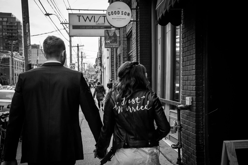A bride wearing #TheJustMarriedJacket on her wedding day.