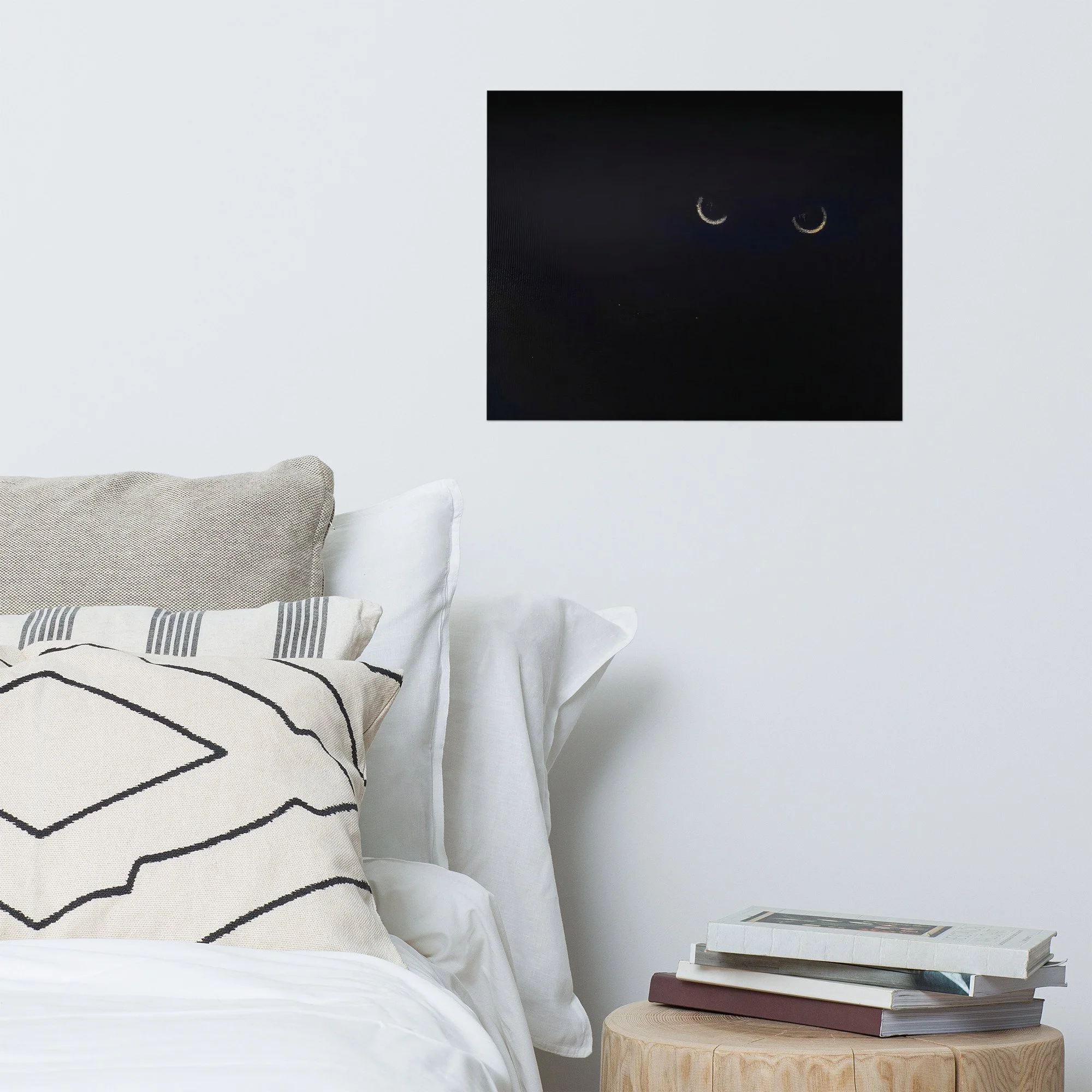 Moody bedroom decor featuring a black cat surrealist art print on a white bedroom wall